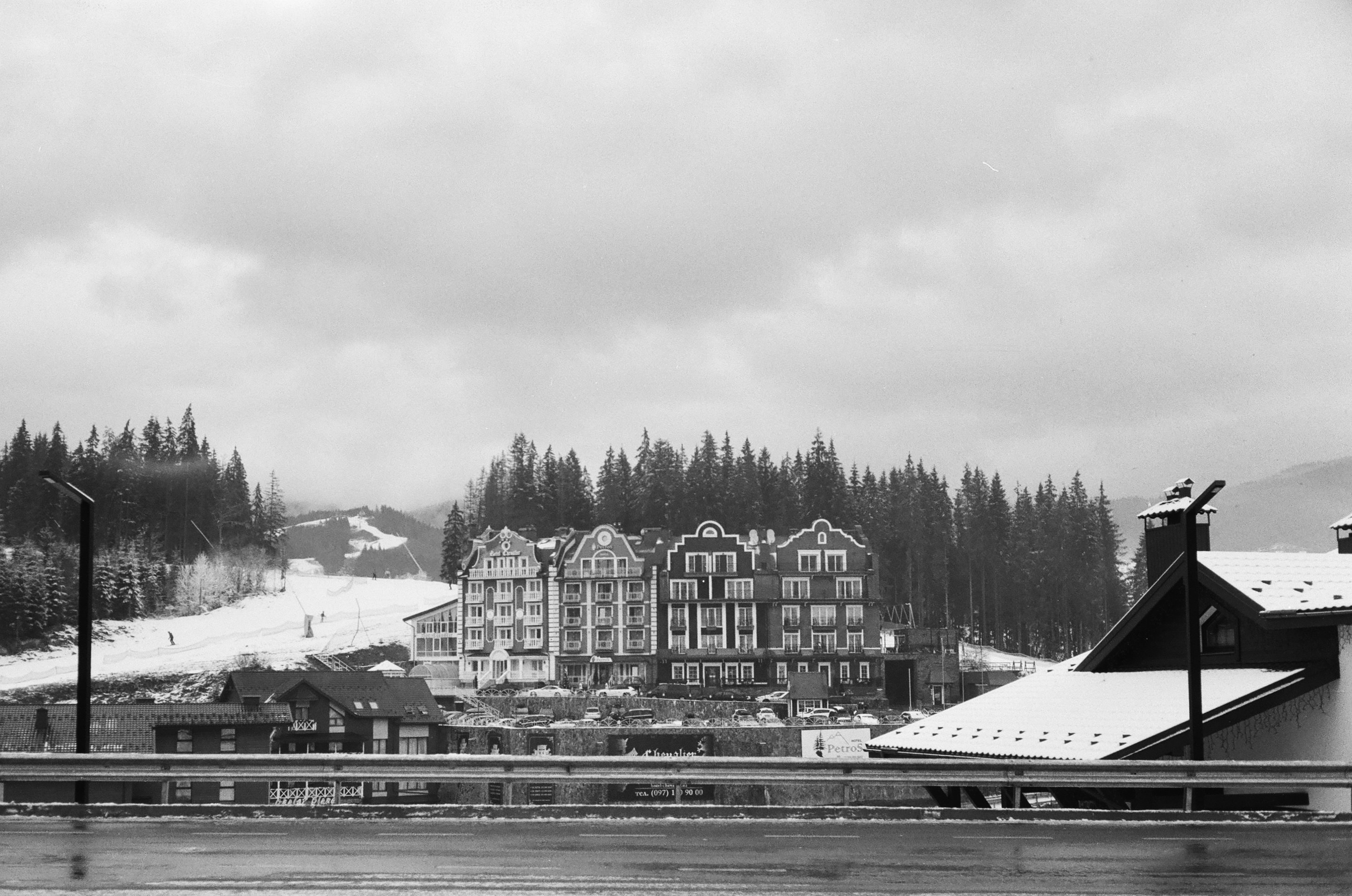 white and black building near body of water